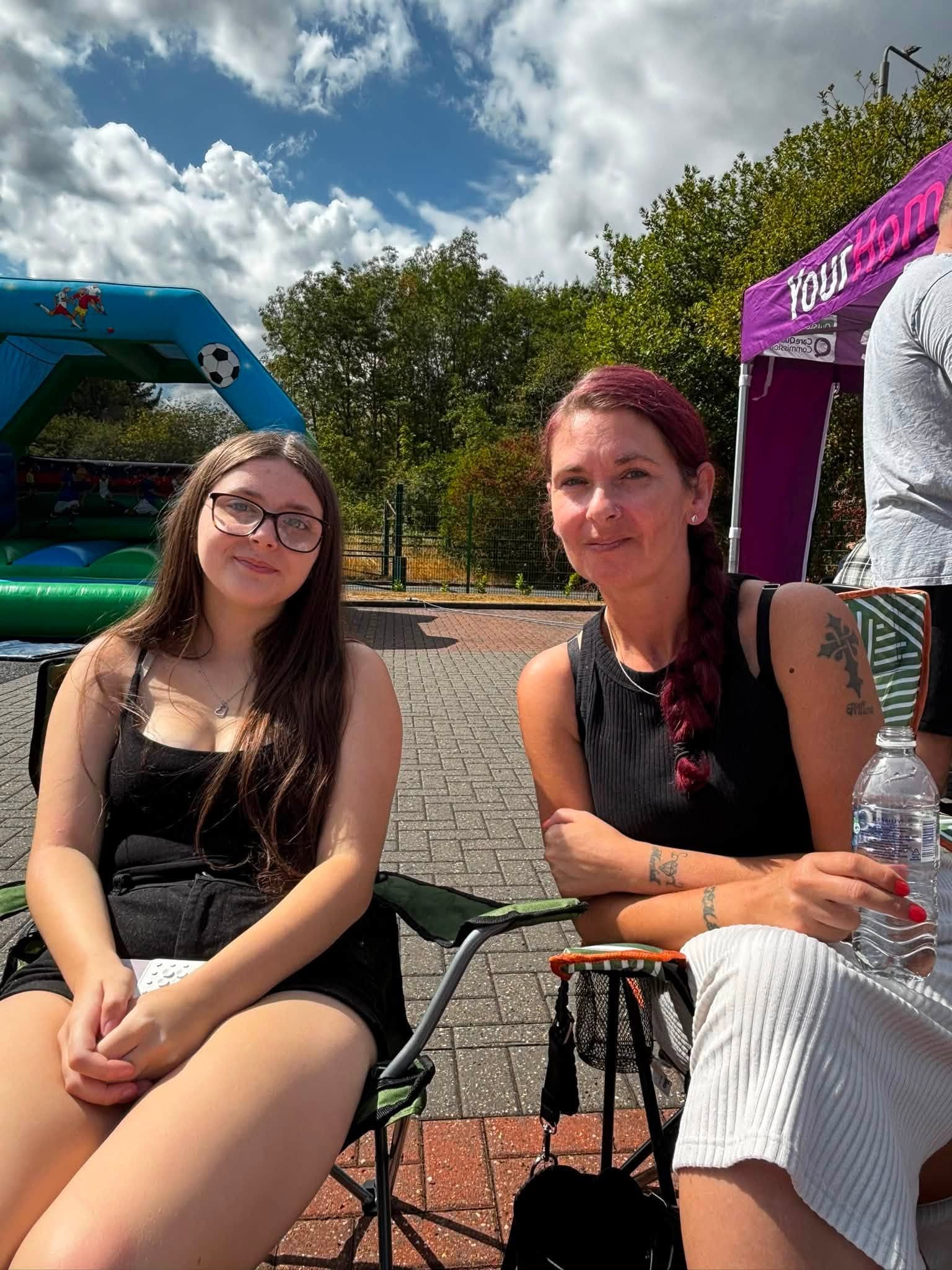 Two members of the Your Home Care community relaxing at the event