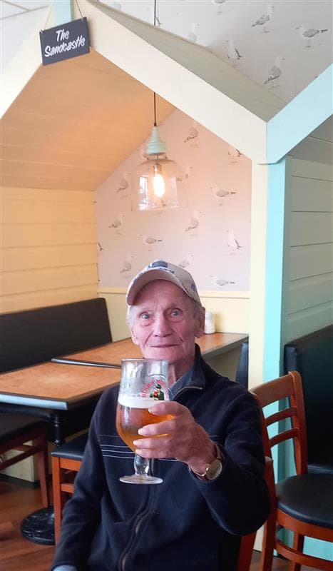 Client enjoying a pint